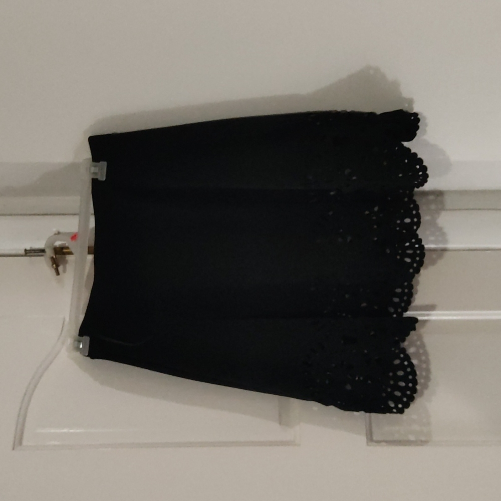 Mini black skirt with lace cutout